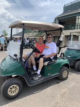 Steadfast volunteers Brenda & Tom head out to witness the hole in one contest.